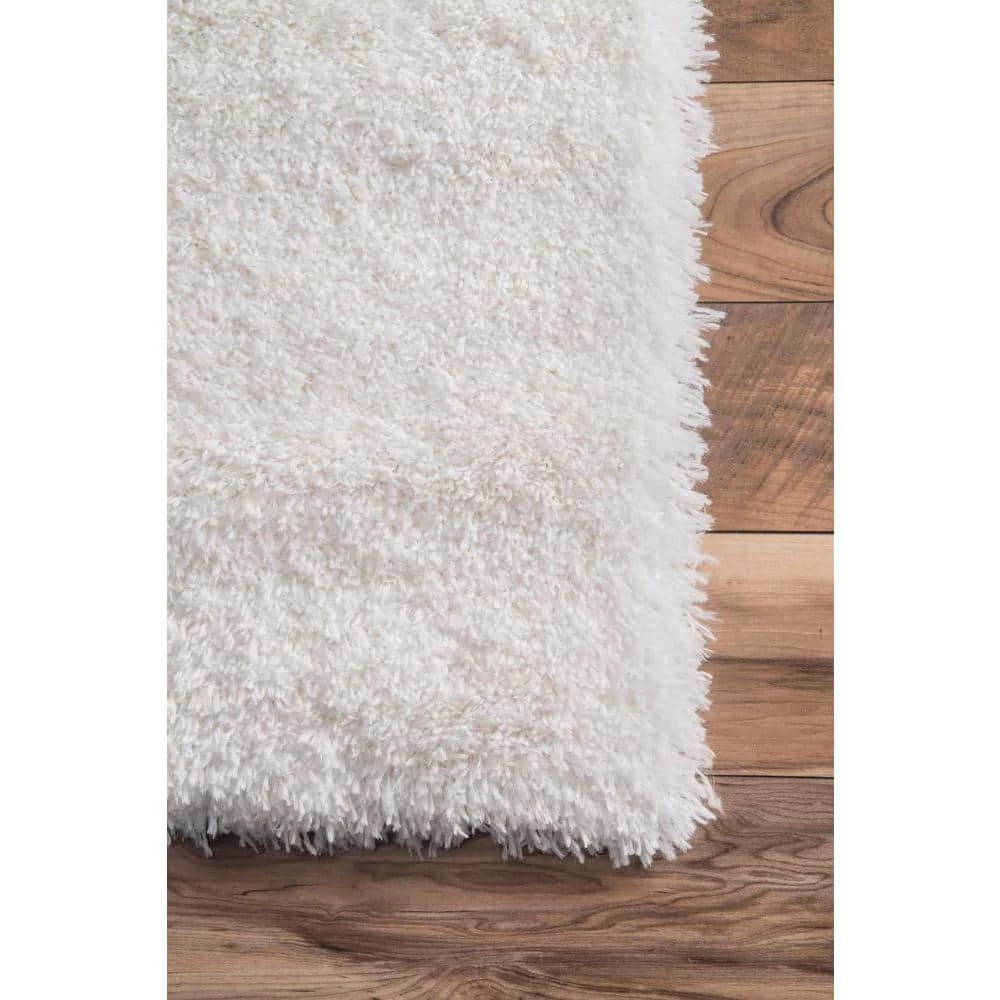 Gynel Solid Shag Snow White 8 ft. x 10 ft. Area Rug by nuLOOM 6 Gynel Solid Shag Snow White 8 ft. x 10 ft. Area Rug by nuLOOM - Image 6